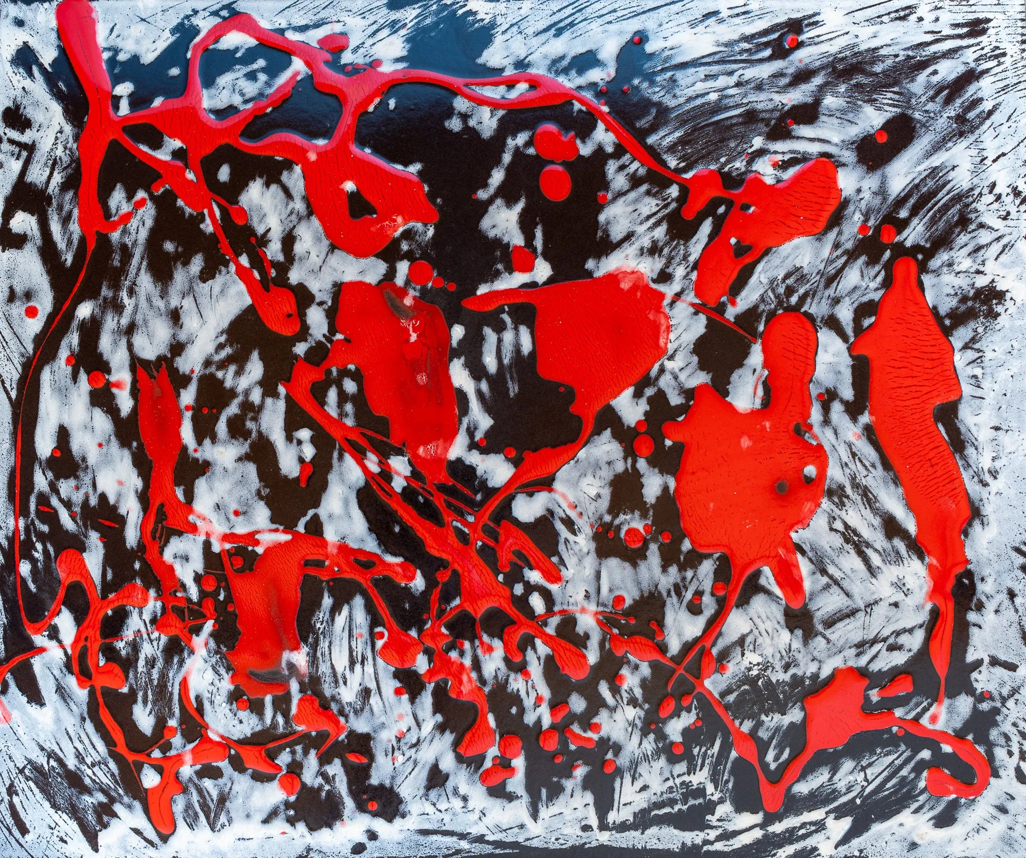 Red splashes on a black and white ground