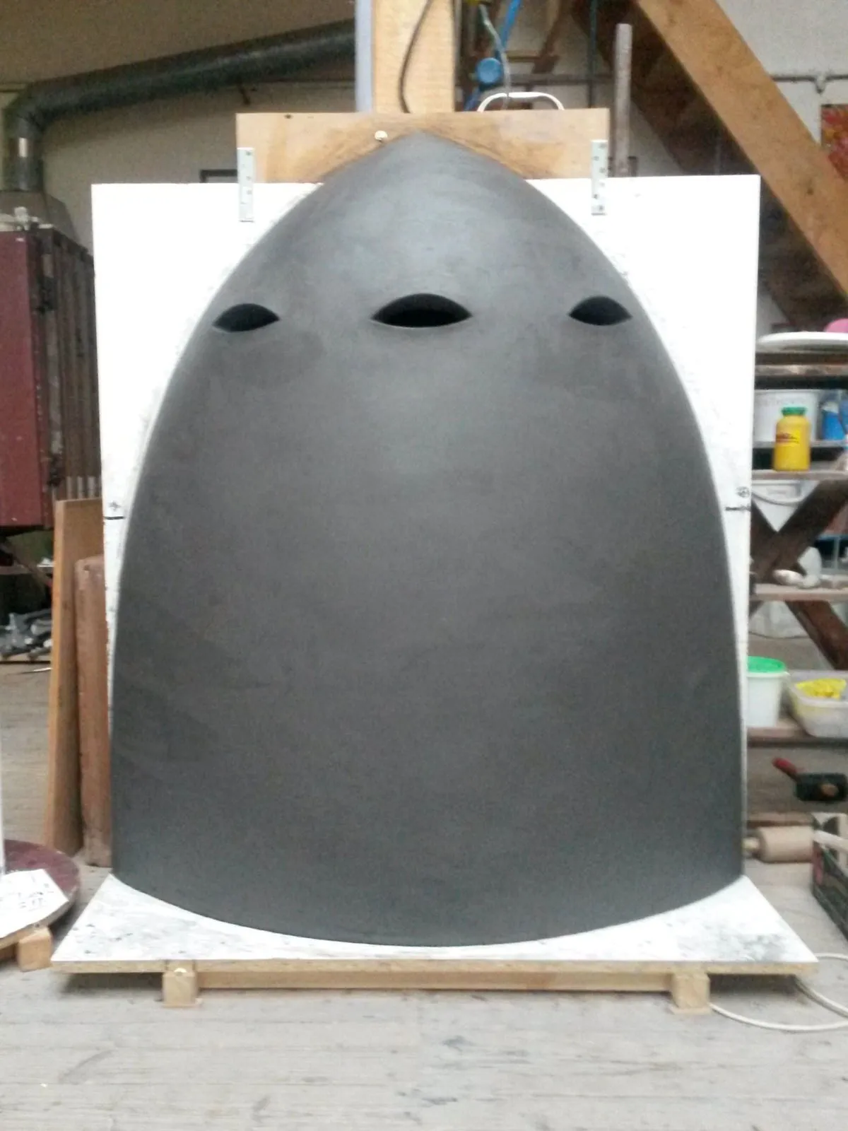 Black domed object with three openings